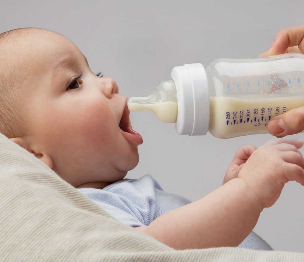 Baby drinking milk from a bottle