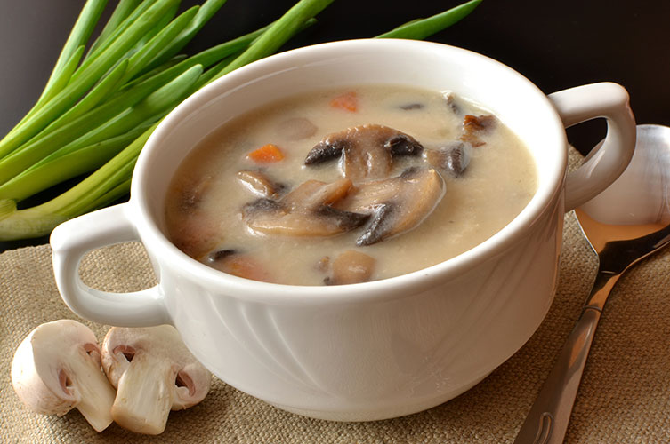 Creamy mushroom soup in a white bowl