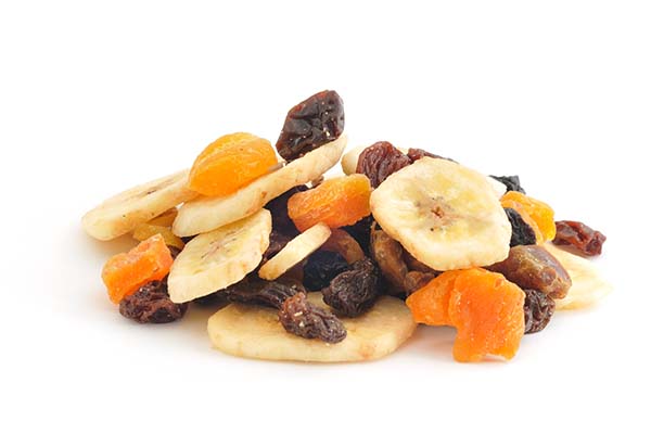 Dried fruit and banana chips on white background