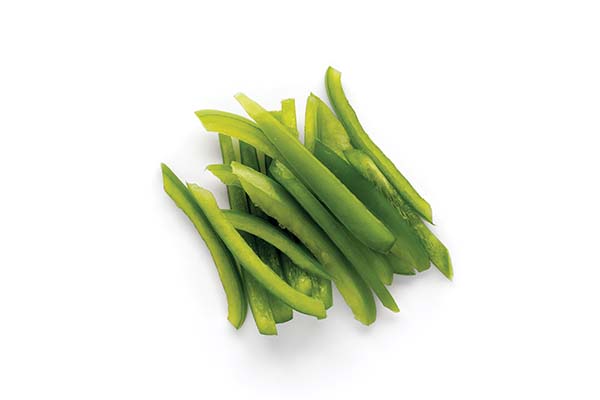 Sliced green bell peppers on white background