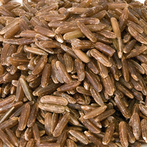 Brown rice grains piled closely together