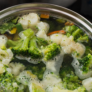 Vegetables boiling in a pot of water