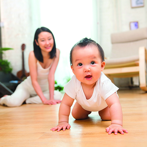 mom playing with baby