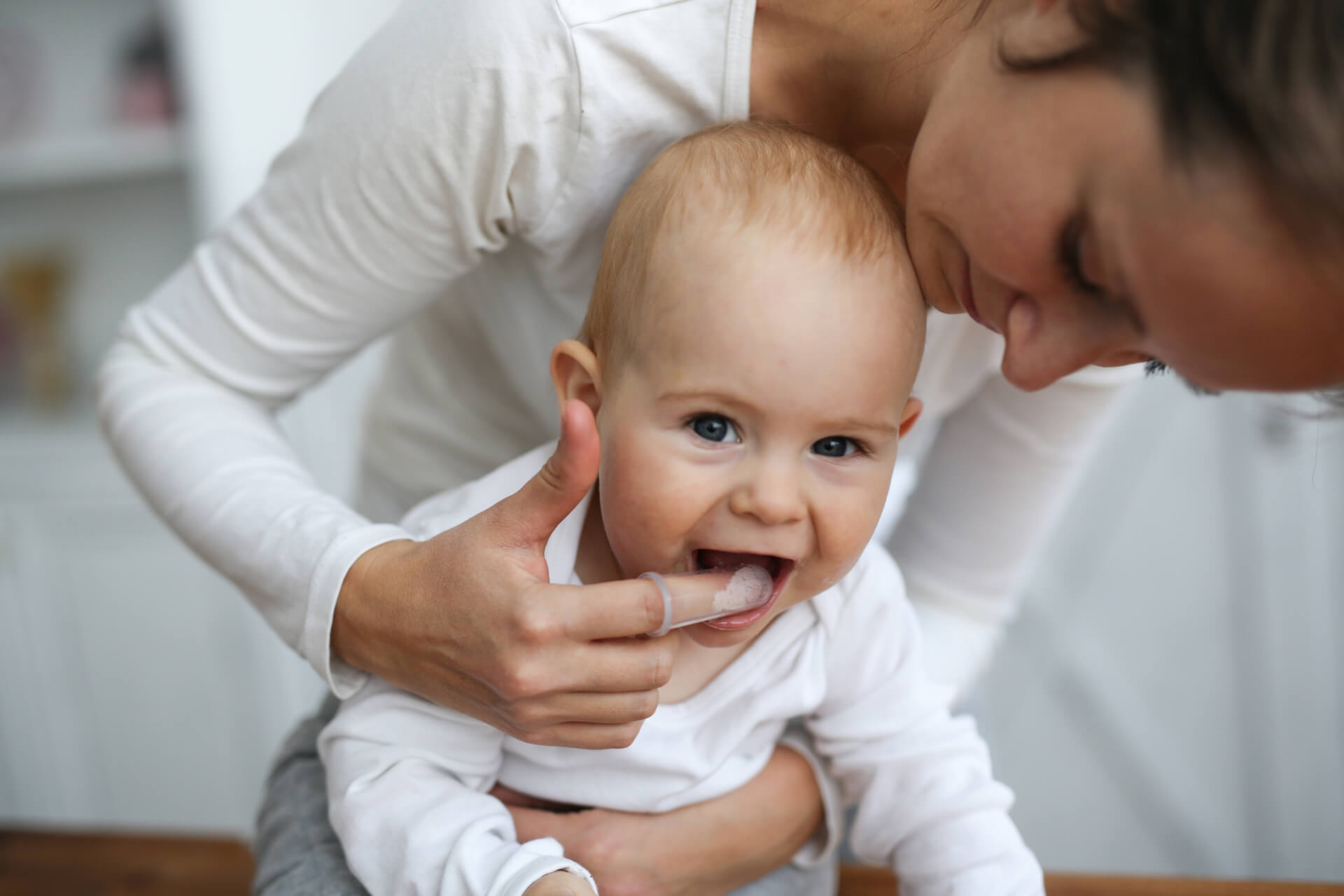 Baby teething with teething ring banner