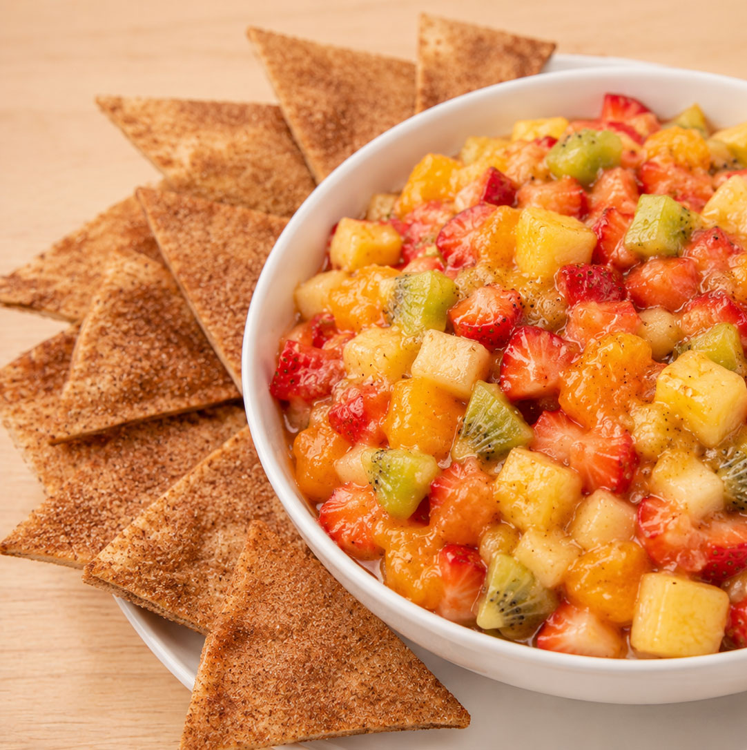 Colorful fruit salad with crispy cinnamon tortilla chips