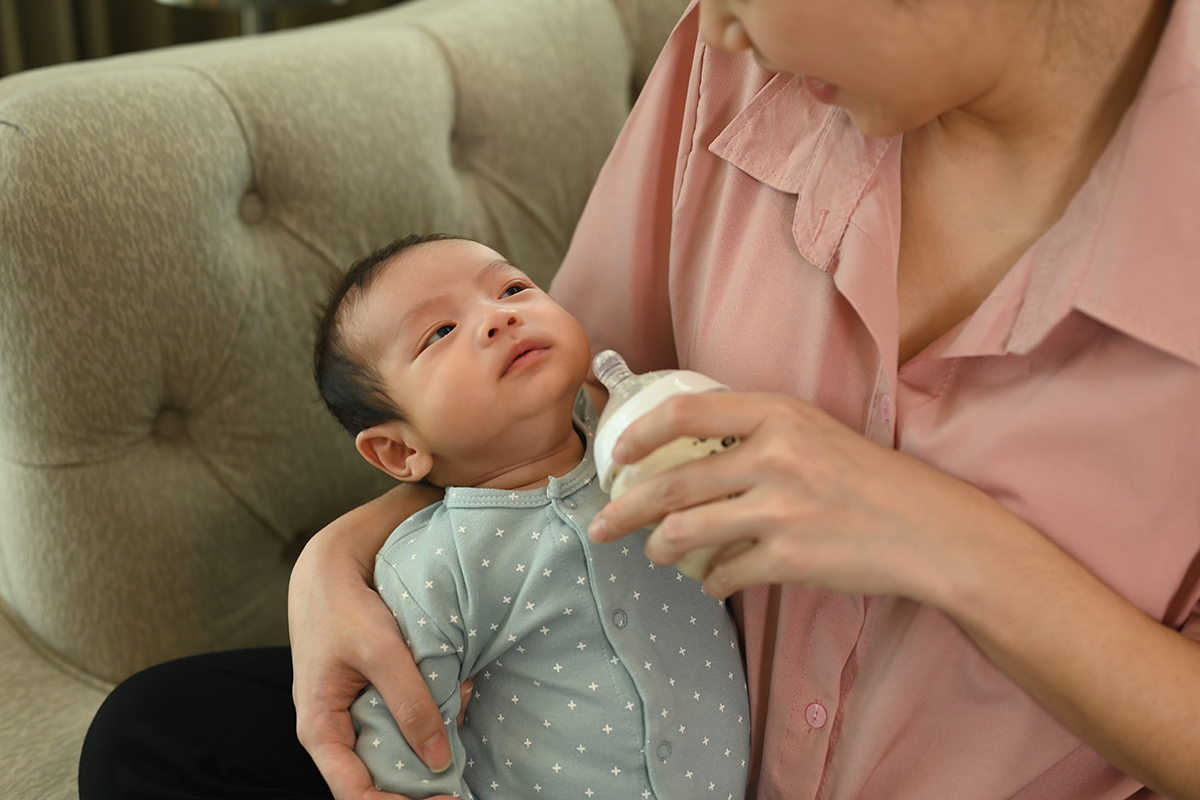 Father feeding a toddler