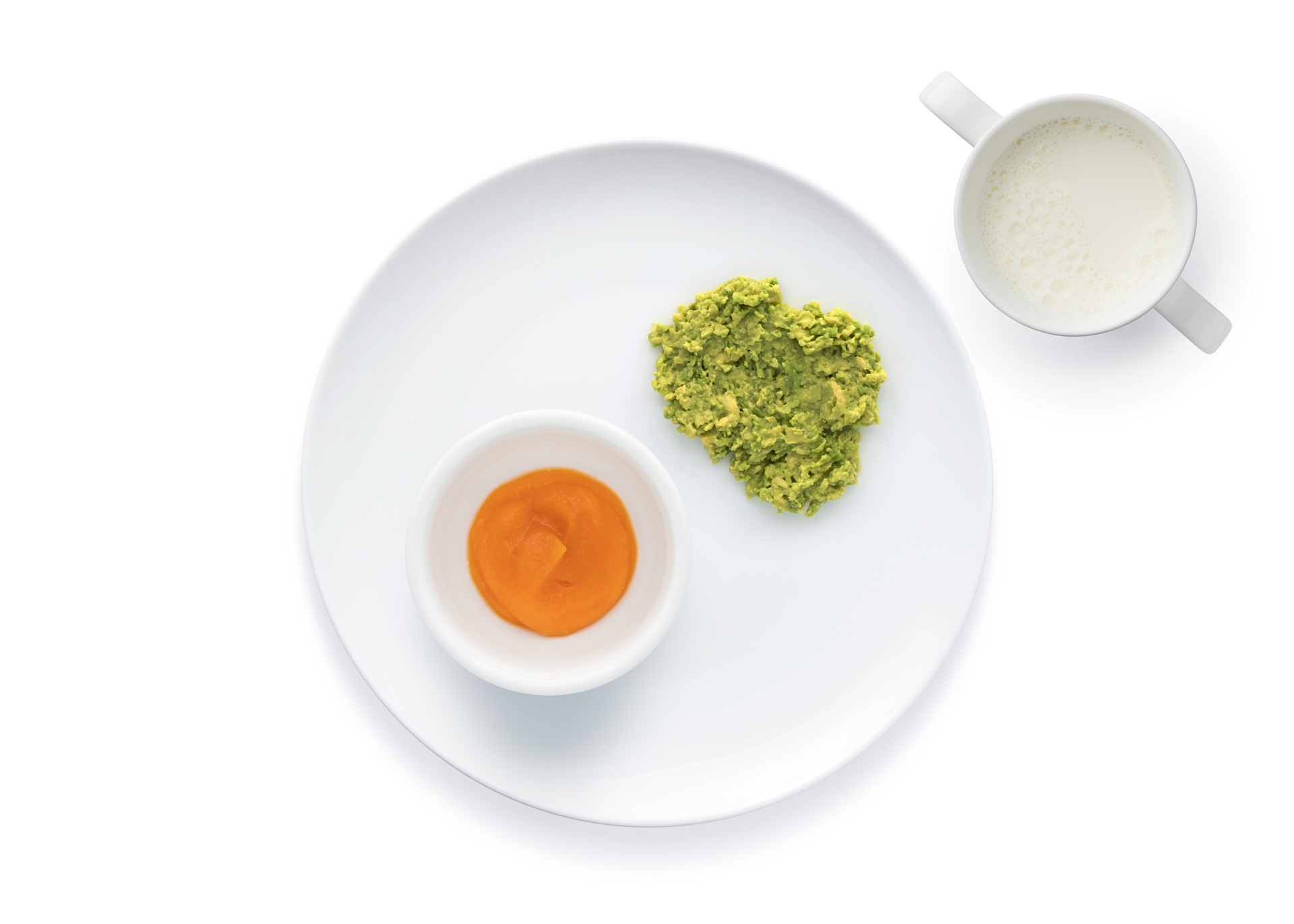 White plate with mashed avocado.