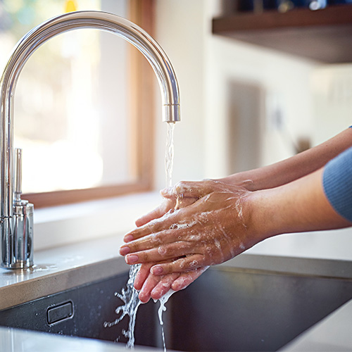 Washing hands at sink