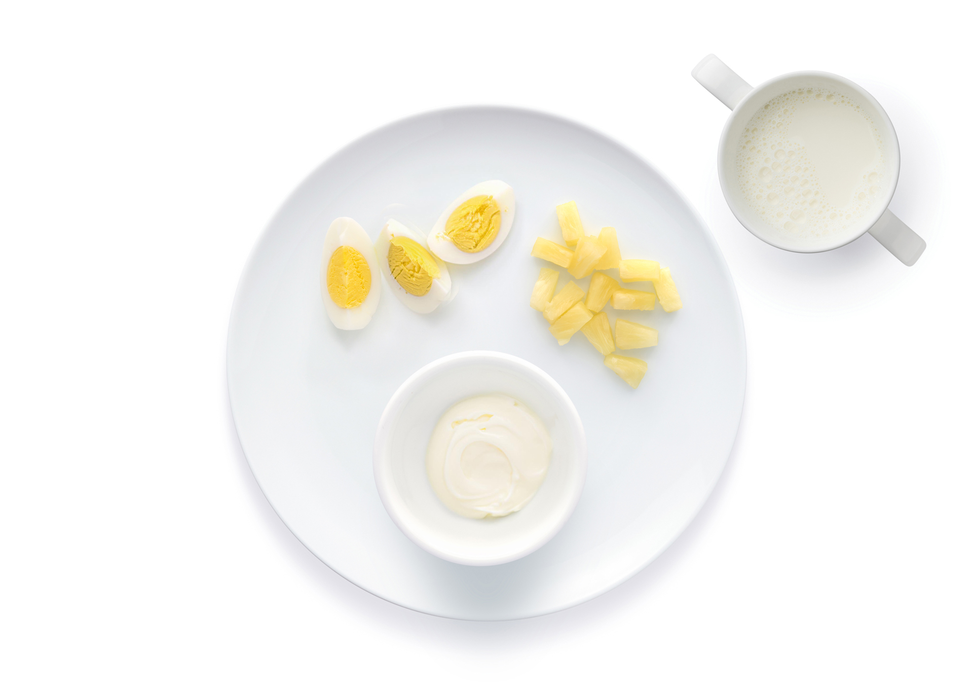 Boiled eggs, diced pineapple, and yogurt