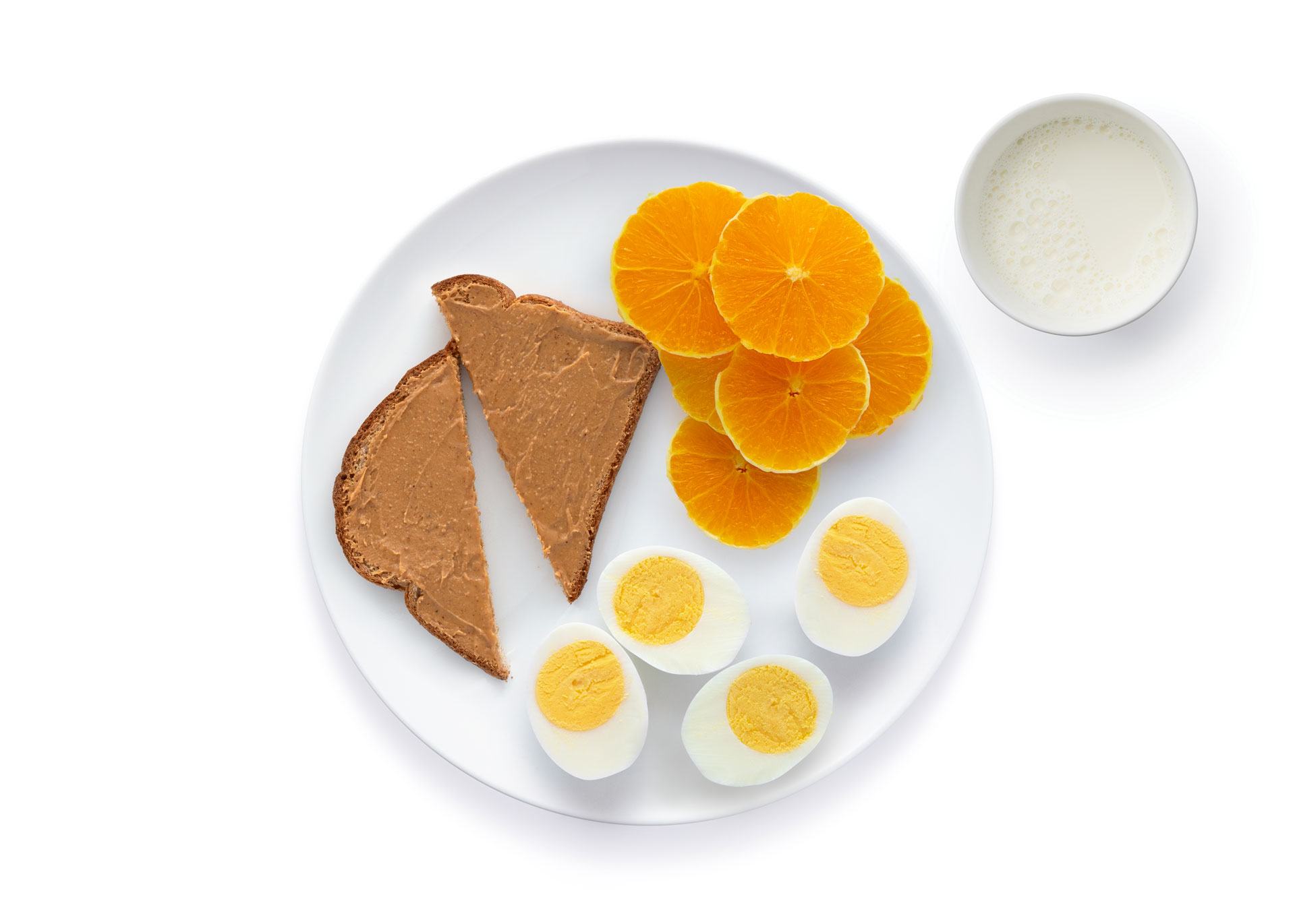Peanut butter toast eggs oranges"