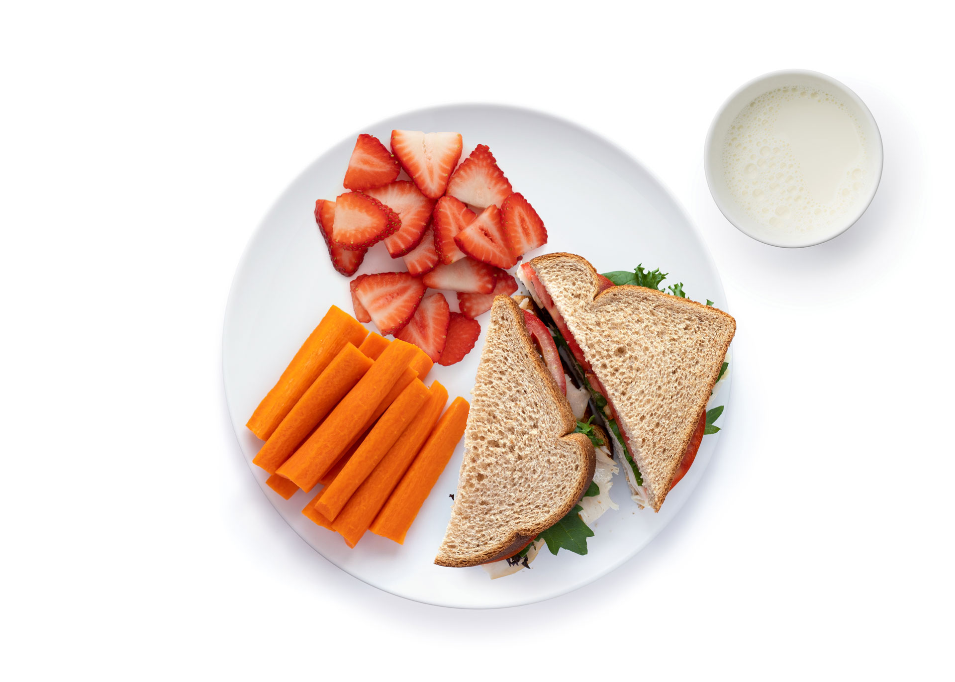Sandwich strawberries carrot sticks plate