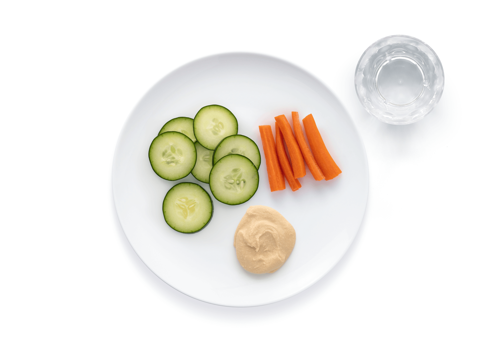 Cucumber slices carrots with hummus