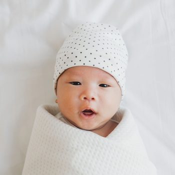Infant wearing cap