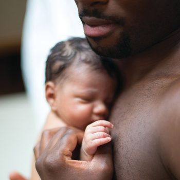 Father holding newborn