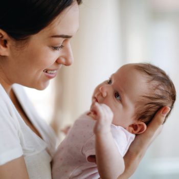 Mother talking baby
